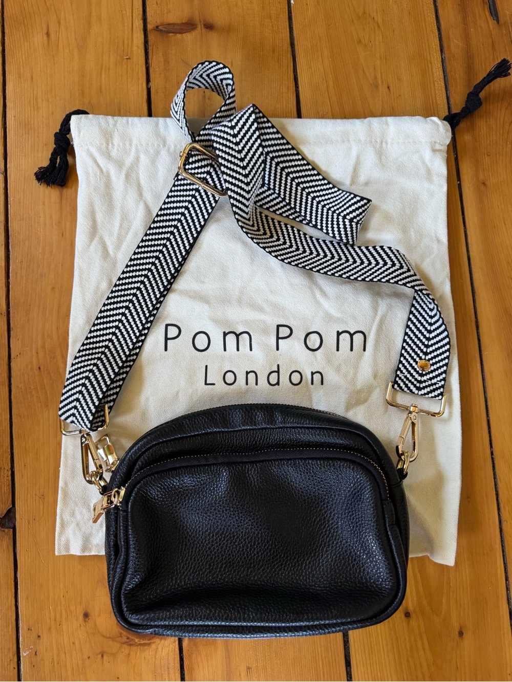 Pom Pom London Mayfair Black Pebbled Leather Crossbody Bag with three straps.